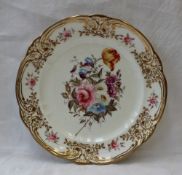 A Nantgarw porcelain plate with a gilt highlighted and moulded border with single roses,