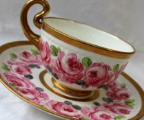 A Swansea porcelain breakfast cup and saucer, with a wide gilt rim,
