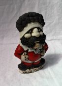 A John Hughes pottery Grogg of a rugby player in the No.8 shirt incised "Wales Forever", 18.