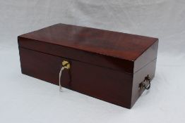 A Victorian mahogany laptop desk, of rectangular form with drop handles enclosing a sloping fall,