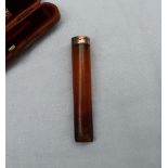 A 9ct gold and amber cheroot holder, cased, stamped W.