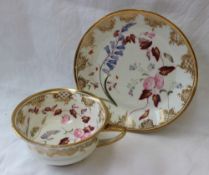 A 19th century English porcelain breakfast cup and saucer, with a gilt line decorated rim,