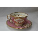 A 19th century English porcelain tea cup and saucer with a feather edge and pink banded border