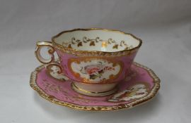 A 19th century English porcelain tea cup and saucer with a feather edge and pink banded border