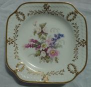 A 19th century English porcelain square plate, the gilt highlighted moulded border,