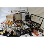 A large quantity of costume jewellery including watches, necklaces, brooches, pendants, earrings,