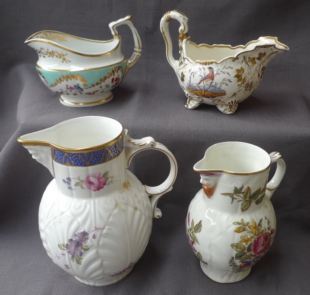 A Coalport "Caughley mask-head jug" together with a Royal Worcester mask jug,