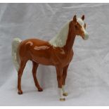 A Beswick model of a palomino pony