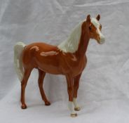 A Beswick model of a palomino pony