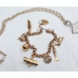 A 9ct yellow gold charm bracelet set with seven charms including a dolphin, fish, 13, aeroplane,