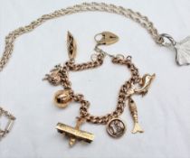 A 9ct yellow gold charm bracelet set with seven charms including a dolphin, fish, 13, aeroplane,