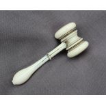 A turned ivory gavel, on a baluster turned handle 12.