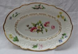 A Swansea porcelain dish of oval form, the gilt decorated border with sprays of garden flowers,