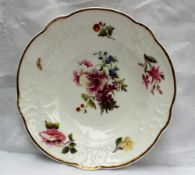 A Nantgarw porcelain bowl, with a gilt line decorated rim, a moulded border,