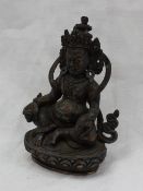 Property of a Viscount: A Tibetan white metal figure of a seated Vaishravana,