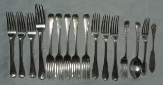 A set of five Victorian silver dessert forks engraved with a family crest, London, 1848,