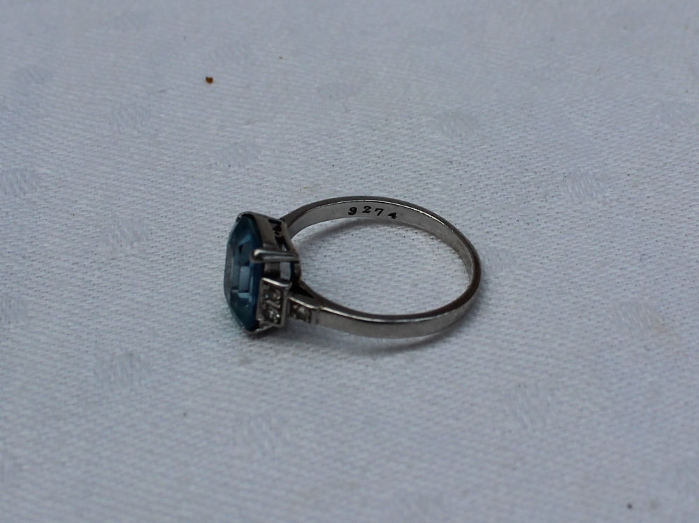 An aquamarine and diamond dress ring, the rectangular faceted aquamarine measuring 10mm x 7mm, - Image 3 of 3