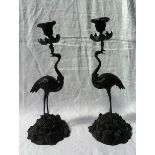 A pair of early 19th century bronze candlesticks in the manner of Thomas Abbott,