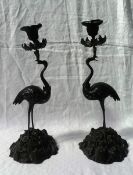 A pair of early 19th century bronze candlesticks in the manner of Thomas Abbott,