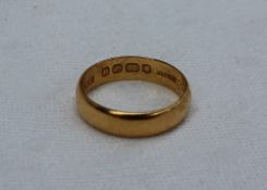 A 22ct yellow gold wedding band,