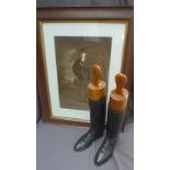 A pair of black leather hunting boots,