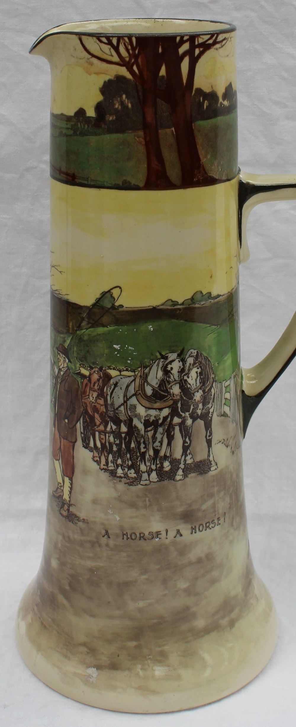 A Royal Doulton pottery series ware jug decorated with a car off the road,