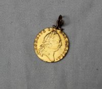 A George III gold spade guinea,