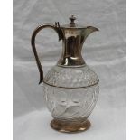 A late Victorian silver topped claret jug, with a tapering neck,