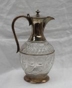 A late Victorian silver topped claret jug, with a tapering neck,
