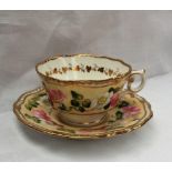A 19th century English porcelain tea cup and saucer, with a feather edge,