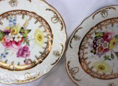 A pair of Swansea porcelain plates with a raised moulded rim with gilt and green highlights,