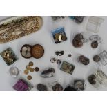 Assorted crowns, together with pennies, sixpences, faux pearls,