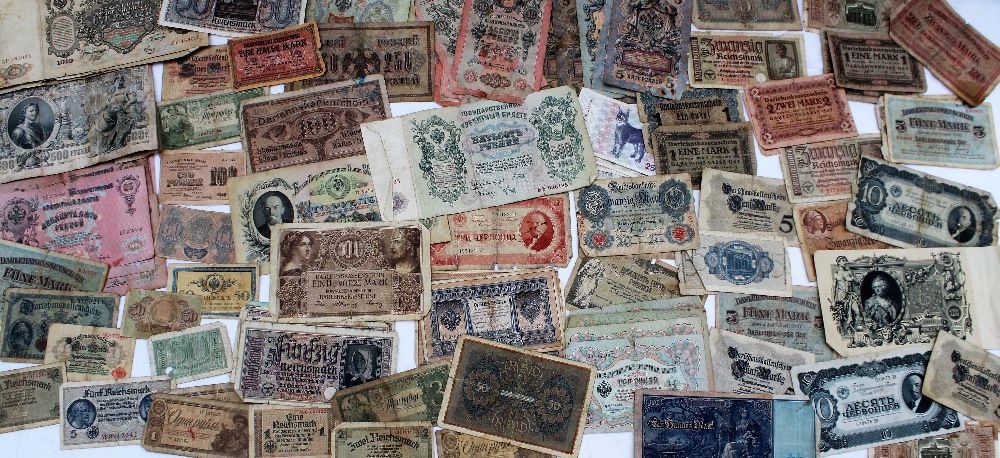 A collection of Russian and German banknotes including 1910 100 Roubles, 1912 500 Roubles,