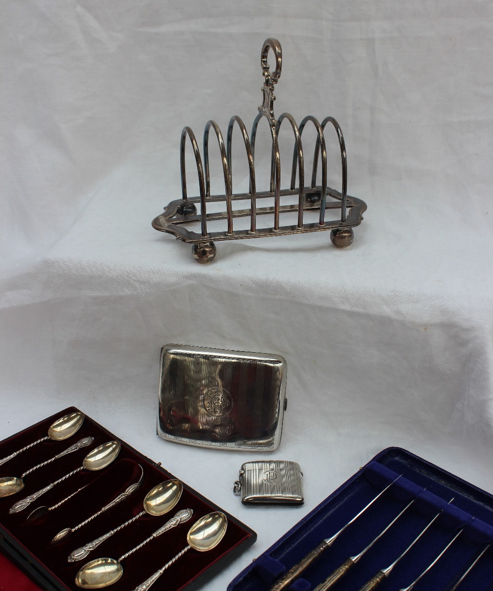 A Victorian silver six division toast rack, Sheffield, 1873, James Thompson,