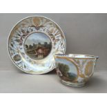 A Derby porcelain tea cup and saucer, with gilt decorated anthemions,