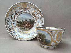 A Derby porcelain tea cup and saucer, with gilt decorated anthemions,