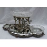 An electroplated table centrepiece with a central raised cut glass bowl,
