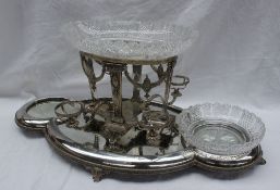 An electroplated table centrepiece with a central raised cut glass bowl,