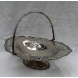 A George V silver swing handled cake basket,