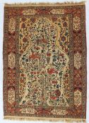 A woolwork tapestry rug decorated with a tree of life, birds and fruit,