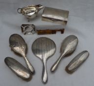 A George VI silver sauce boat, Birmingham, 1947, together with a silver cigarette box,