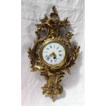 An ormolu wall clock, of rococo form decorated with scrolls and leaves,