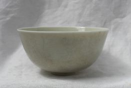 Property of a Viscount: A Chinese porcelain bowl with a white crackle glaze on a small foot,