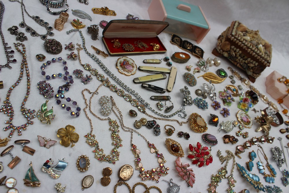 Assorted costume jewellery including necklaces, hat pins, cufflinks, earrings, penknives, brooches,