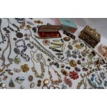 Assorted costume jewellery including necklaces, hat pins, cufflinks, earrings, penknives, brooches,