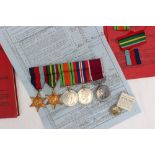 A set of five World War II medals including War medal, Defence medal, The 1939-1945 Star,