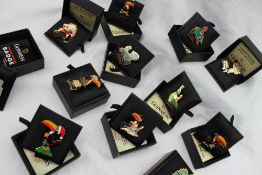 A set of Twelve Guinness limited edition badges including "Red Indian with canoe", No.