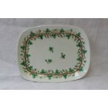A Swansea porcelain tea pot stand of rectangular form decorated with a continuous band of vines and