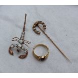 A horse shoe shaped pearl set stick pin in a yellow metal setting marked 18ct together with an 18ct