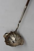 A Victorian silver ladle with a ring turned wooden handle,